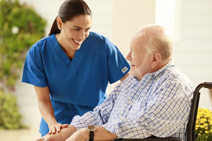 Carer helping a client outdoors